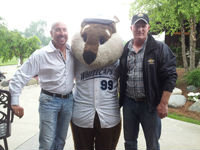 Scott Vander Kolk Jr. and Lucas Spoor with the West Michigan White Caps mascot 'Crash' at the Mel Trotter Ministries golf outing and auction.
